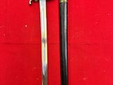 a close up of a sword on a red surface with a red background
