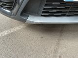 a close up of the front of a car with a license plate on it