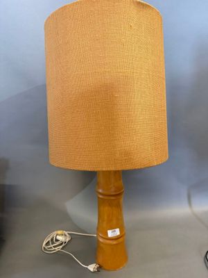 a lamp that is sitting on a table next to a lamp