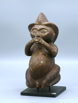 an image of a statue of a monkey with a hat on it ' s head