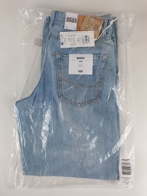 the back of a pair of light blue jeans wrapped in plastic