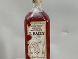 a bottle of whiskey sitting on top of a glass stand