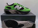 a close up of a pair of green and black sneakers