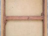 an old wooden frame with a piece of wood in it