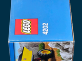 a box with a lego construction vehicle inside of it