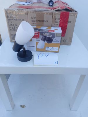 a white table with a lamp and a box on it