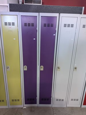 several metal lockers are lined up in a row in a room