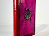 an image of a red book with a beetle on it