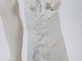 a statue of a man and a woman holding hands