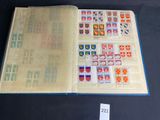 a book with stamps on it sitting on a table