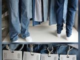 a display of men ' s jeans on display in a store