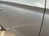 a close up of a car door handle with a sticker on it