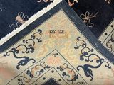 an image of a close up of a rug with a cat on it