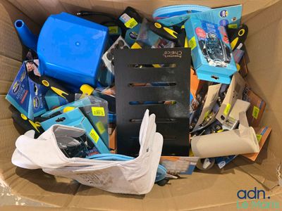 a cardboard box filled with assorted items and tools