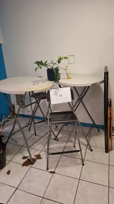 a small table and chairs in the corner of a room
