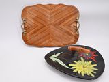 brown leather purse and plate with flowers on it on a white surface