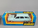 a small toy car in a box on a table