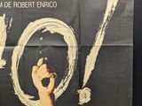 movie poster of a man holding a knife in his right hand