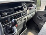 a dashboard of a car with a steering wheel and a control panel