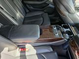 the interior of a car with leather seats and a center console