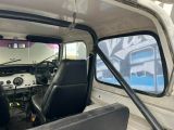 a view of the inside of a truck from the driver ' s seat