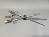 four knives that are laying on top of each other