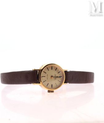 a close up of a wrist watch on a white surface