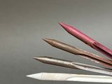 several different colored pencils are lined up on top of each other