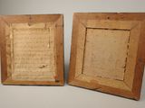 pair of antique wooden picture frames with old writing on them