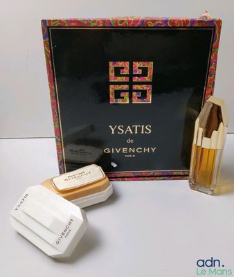 a box of perfumes and a box of soap sitting on a table