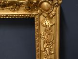 an image of a gold frame with a black wall in the background