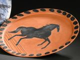 a plate with a picture of a horse on it