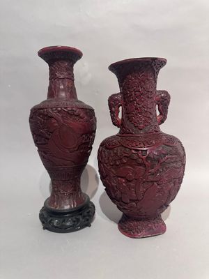 two vases sitting next to each other on a table