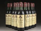 six bottles of wine are lined up in a row on a table