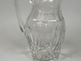 clear glass pitcher on a white surface