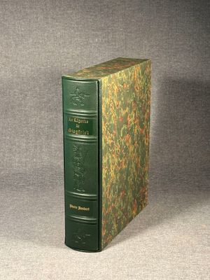 a green book that is sitting on a table