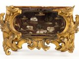 a gold frame with a picture of a ship in it