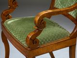 an image of a chair with a green upholstered upholstered seat