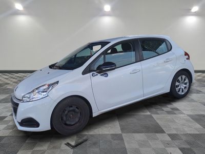 a white car parked in a room with a checkered floor