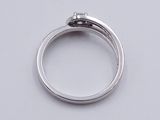 a silver ring with a diamond on top of it