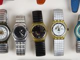 a lot of watches that are sitting on a table