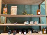 many jars of food on the shelves in the room