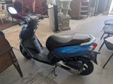 a scooter that is parked in the garage