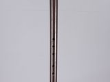 a wooden flute on a clear acrylic stand on a white background