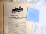 un livre sur lequel figure l'image d'un château, avec une feuille de papier posée dessus
