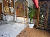 a lamp that is on a tripod in a room