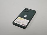 a green apple phone with a white sticker on it