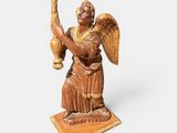 an image of a statue of an angel holding a candle