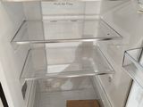 an open refrigerator with the door open and a wooden box in it