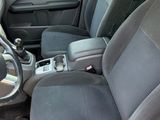 the interior of a car with two seats and a steering wheel
